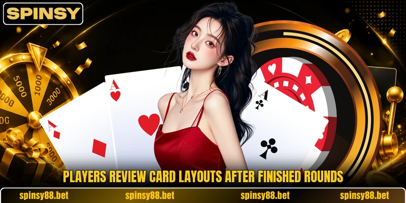 Players review card layouts after finished rounds